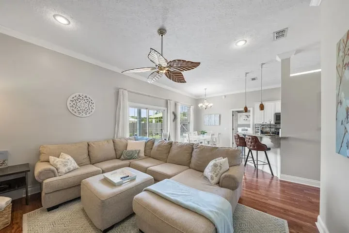 Bright living room opening into the kitchen at Seaside Paradise